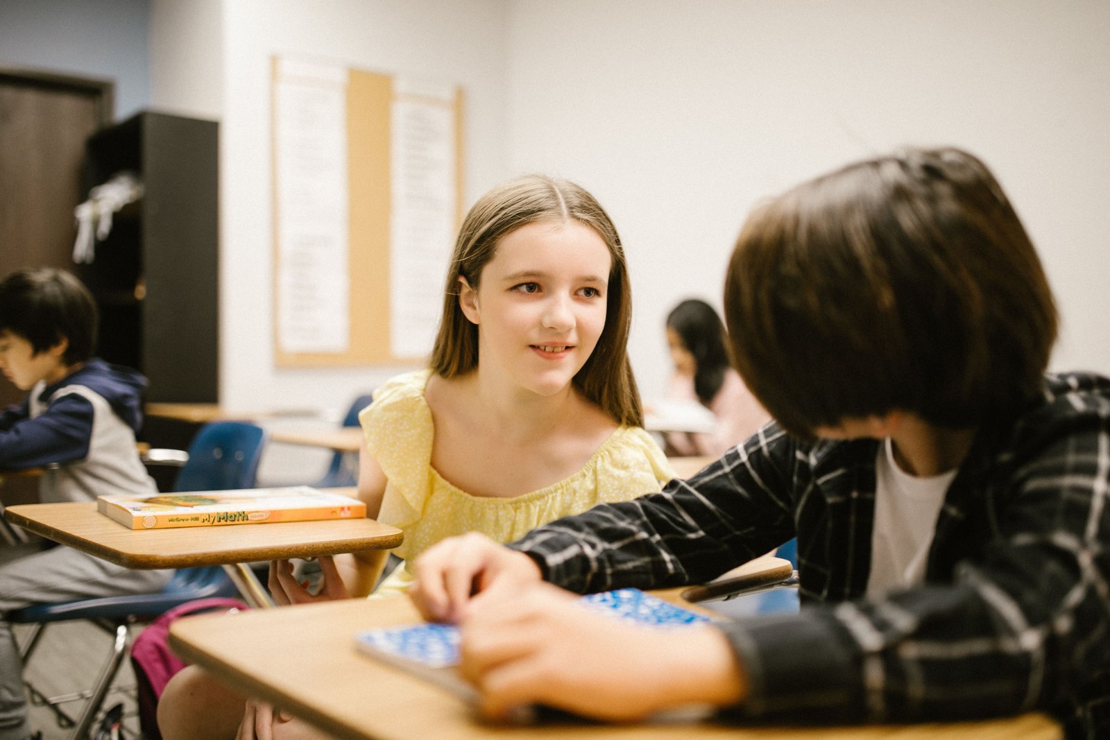 Two students talking and engaging confidently with each other during interview training